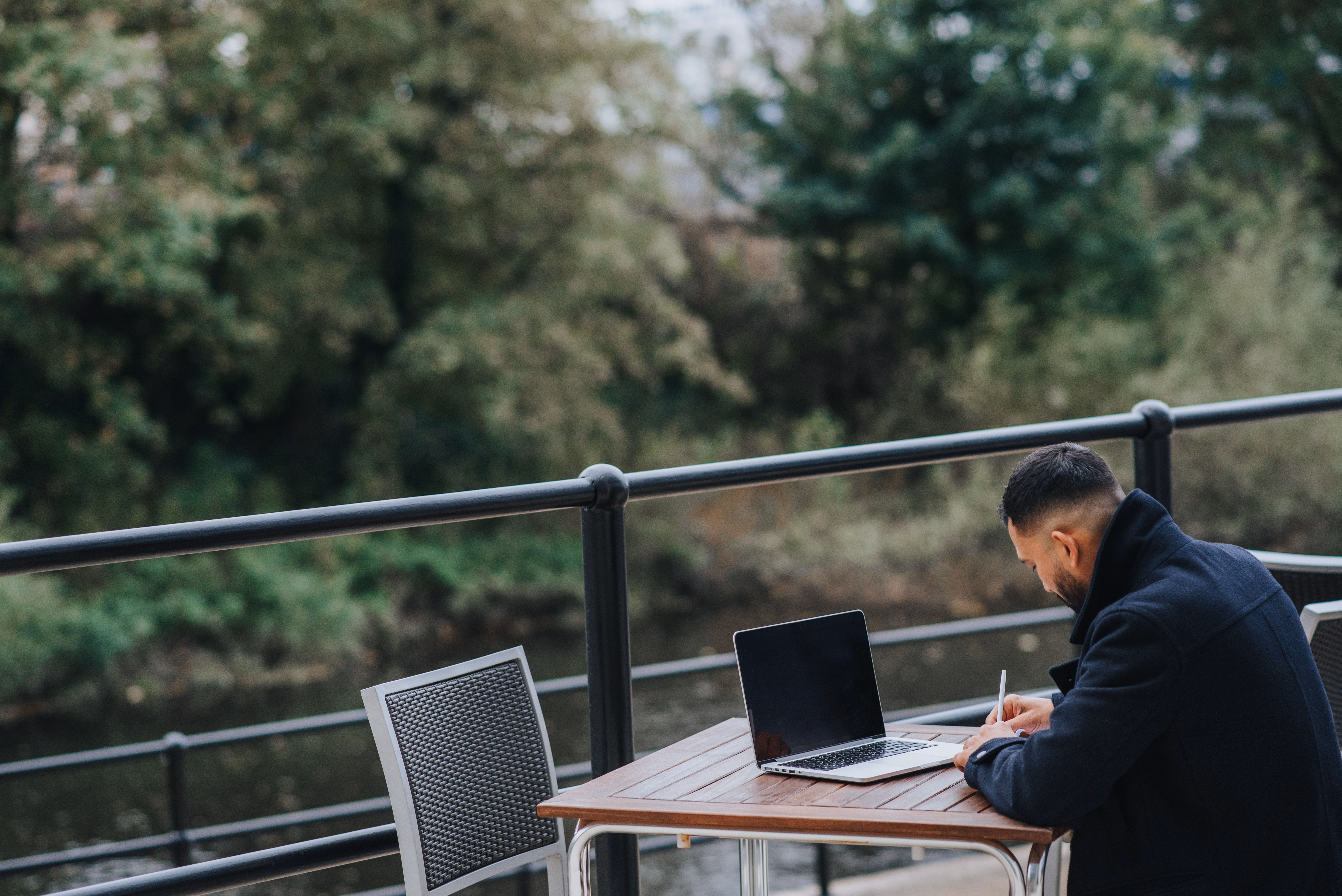 Person working outdoors from a laptop